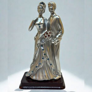 Elegant silver figurine of a bride and groom standing together, celebrating love and marriage